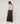 Kurze Strickjacke mit Schulterpolstern - Beige meliert