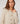 Kurze Strickjacke mit Schulterpolstern - Beige meliert